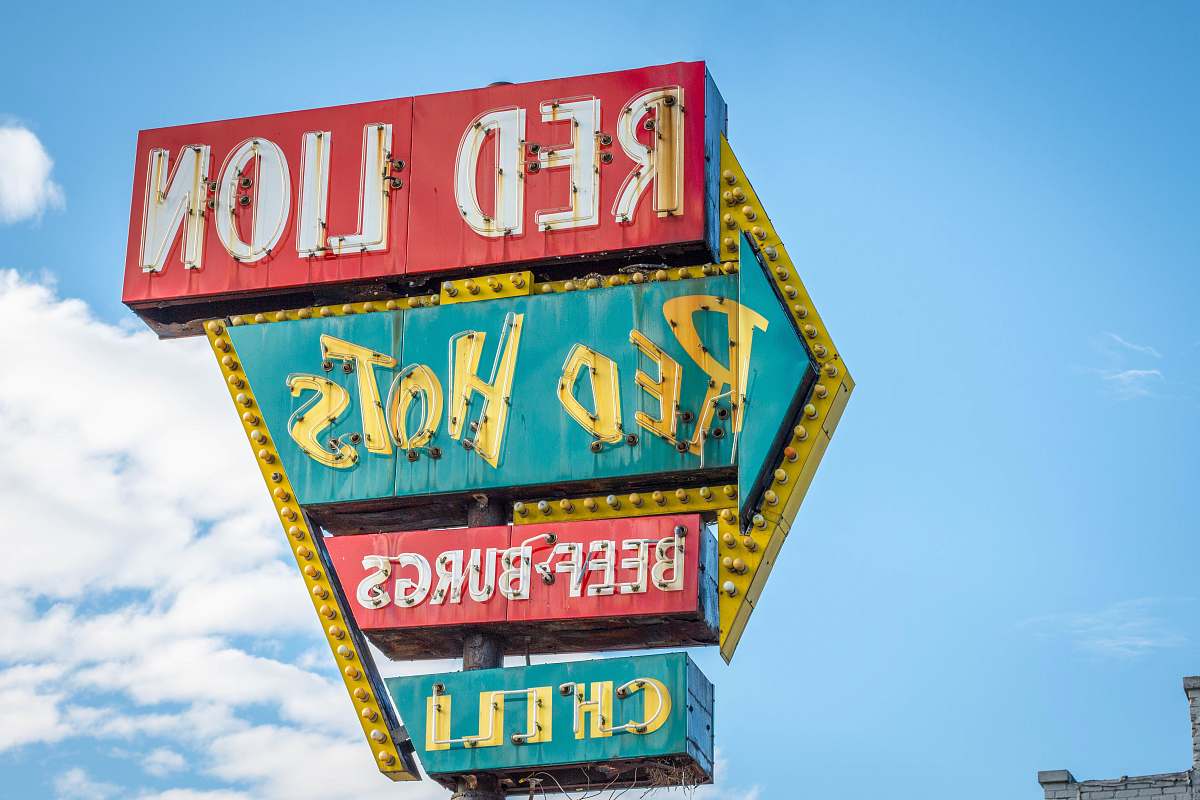 grand rapids Red Lion, Red Hots, Beef Burgs, and Chili signage under white and blue cloudy skies 300 michigan st ne